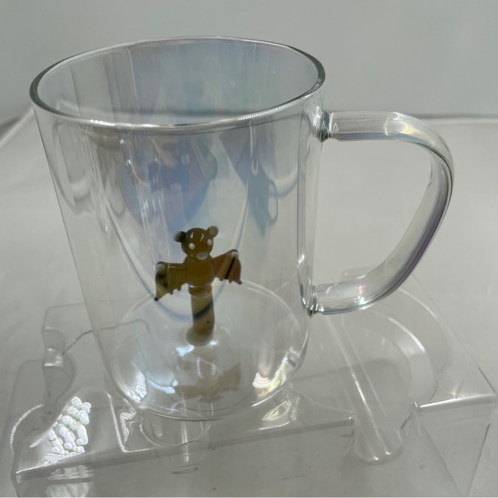 Iridescent Glass Mug with a Glass Bat Inside